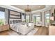 Luxurious main bedroom with hardwood floors and sitting area at 10160 Silent Night Ln, Sarasota, FL 34241