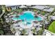 Large resort-style pool with plenty of lounge chairs at 10160 Silent Night Ln, Sarasota, FL 34241