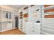 Bright walk-in closet with custom built-ins and organizers at 10160 Silent Night Ln, Sarasota, FL 34241