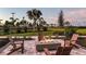 Evening fire pit with Adirondack chairs at 10446 Morning Mist Ln, Sarasota, FL 34241