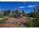 playground with a wooden playhouse and slide at 10446 Morning Mist Ln, Sarasota, FL 34241