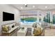Relaxing pool area with outdoor seating and sunset view at 10446 Morning Mist Ln, Sarasota, FL 34241