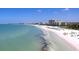 Expansive beach view with hotels and clear water at 1275 Siesta Bayside Dr # 1275, Sarasota, FL 34242