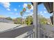Enjoy scenic views from this private balcony overlooking lush landscaping and palm trees at 1275 Siesta Bayside Dr # 1275, Sarasota, FL 34242