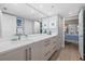 Modern bathroom with double vanity and marble countertops at 1275 Siesta Bayside Dr # 1275, Sarasota, FL 34242