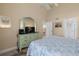 Bedroom with TV, dresser, and view into hallway at 1275 Siesta Bayside Dr # 1275, Sarasota, FL 34242