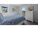 Bedroom with a queen-size bed and white dresser at 1275 Siesta Bayside Dr # 1275, Sarasota, FL 34242