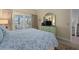 Bedroom with king-size bed, dresser, and access to balcony at 1275 Siesta Bayside Dr # 1275, Sarasota, FL 34242