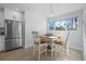 Bright dining area with table and chairs near kitchen at 1275 Siesta Bayside Dr # 1275, Sarasota, FL 34242