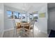 Bright dining area with table and chairs near kitchen at 1275 Siesta Bayside Dr # 1275, Sarasota, FL 34242