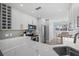 Modern kitchen with white cabinets and quartz countertops at 1275 Siesta Bayside Dr # 1275, Sarasota, FL 34242