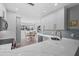 Modern kitchen with white cabinets and quartz countertops at 1275 Siesta Bayside Dr # 1275, Sarasota, FL 34242