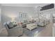 Spacious living room with comfortable seating and a view to the upper loft at 1275 Siesta Bayside Dr # 1275, Sarasota, FL 34242