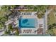 Community pool with lounge chairs and landscaping at 1275 Siesta Bayside Dr # 1275, Sarasota, FL 34242