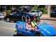 Two women enjoying a ride in a blue car at 1275 Siesta Bayside Dr # 1275, Sarasota, FL 34242