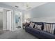 Cozy sitting area with sofa and view into bathroom at 1275 Siesta Bayside Dr # 1275, Sarasota, FL 34242