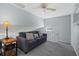 Upstairs sitting area with sofa and views from a circular window at 1275 Siesta Bayside Dr # 1275, Sarasota, FL 34242