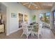 Bright sunroom with glass doors and windows, offering water views at 1275 Siesta Bayside Dr # 1275, Sarasota, FL 34242