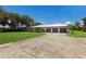 Single-story home with three-car garage and lush lawn at 1655 51St W St, Bradenton, FL 34209