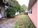 Large backyard with room for outdoor activities and gardening at 1741 Font Ln, Holiday, FL 34691