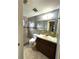 Updated bathroom with a walk-in shower at 1741 Font Ln, Holiday, FL 34691