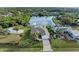 Aerial view of a waterfront home with a large backyard and dock at 17413 Pheasant Cir, Port Charlotte, FL 33948