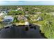 Aerial view showcasing a waterfront home with private dock at 17413 Pheasant Cir, Port Charlotte, FL 33948