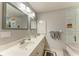 Double vanity bathroom with updated fixtures at 17413 Pheasant Cir, Port Charlotte, FL 33948
