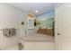 Bathroom boasts a nautical-themed mural and built-in bench at 17413 Pheasant Cir, Port Charlotte, FL 33948