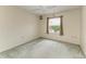 Cozy bedroom with carpet and window overlooking the water at 17413 Pheasant Cir, Port Charlotte, FL 33948