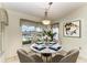 Cozy breakfast nook with water views and seating for four at 17413 Pheasant Cir, Port Charlotte, FL 33948