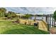 Large composite dock with covered boat lift overlooking the canal at 17413 Pheasant Cir, Port Charlotte, FL 33948