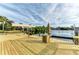 Expansive wooden dock offering scenic canal views at 17413 Pheasant Cir, Port Charlotte, FL 33948