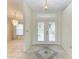 Bright entryway with double doors and tile flooring at 17413 Pheasant Cir, Port Charlotte, FL 33948