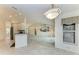 Open kitchen with breakfast bar and view of living room at 17413 Pheasant Cir, Port Charlotte, FL 33948