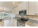 Kitchen features granite countertops and stainless steel appliances at 17413 Pheasant Cir, Port Charlotte, FL 33948