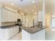Kitchen with granite countertops and white cabinets at 17413 Pheasant Cir, Port Charlotte, FL 33948