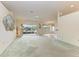 Spacious living room with water views and ceiling fan at 17413 Pheasant Cir, Port Charlotte, FL 33948