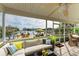 Spacious screened lanai with comfortable seating and water views at 17413 Pheasant Cir, Port Charlotte, FL 33948