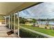 Screened porch with view of canal and dock at 17413 Pheasant Cir, Port Charlotte, FL 33948