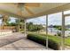 Relaxing screened porch overlooking a canal with a private dock at 17413 Pheasant Cir, Port Charlotte, FL 33948