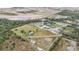 Aerial view of property showing home, various buildings, and surrounding area at 19990 E State Road 64, Bradenton, FL 34212