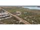 Aerial view of property showing home, outbuildings, and surrounding land at 19990 E State Road 64, Bradenton, FL 34212