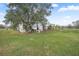 Single-wide mobile home with a large backyard at 19990 E State Road 64, Bradenton, FL 34212