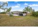 Metal outbuilding with screened sides and open-air structure at 19990 E State Road 64, Bradenton, FL 34212