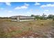 Metal outbuilding with screened sides and open-air structure at 19990 E State Road 64, Bradenton, FL 34212