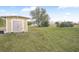 Tan colored storage shed in backyard at 19990 E State Road 64, Bradenton, FL 34212