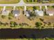 Single-story home near a canal with neighboring homes at 20096 Tappan Zee Dr, Port Charlotte, FL 33952