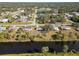 Bird's-eye view of a neighborhood near a canal at 20096 Tappan Zee Dr, Port Charlotte, FL 33952