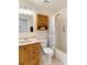 Neat bathroom with shower/tub, vanity, and cabinet at 20096 Tappan Zee Dr, Port Charlotte, FL 33952